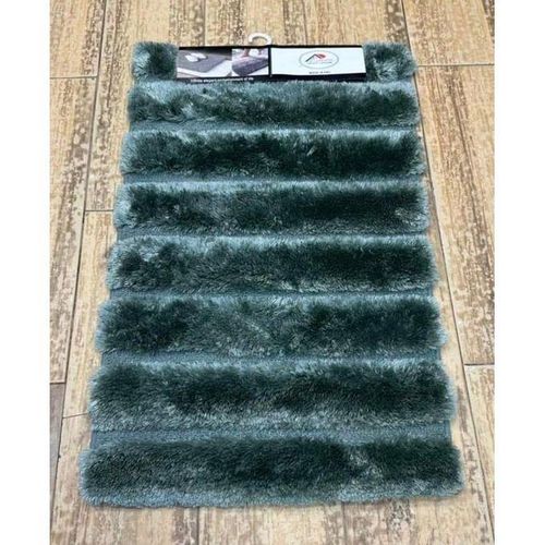 Ce tapis de bain en microfibre rose de la marque SoHo, mode Ty- LINE, est doté d’une fonction Antidérapante
