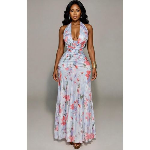 Robe longue fluide dos-nu à imprimé floral sa coupe ajustée à la taille et son bas subtilement évasée.
