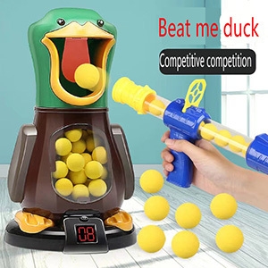 Jeu de tir coloré avec porte-cible en forme de canard et lance-balles. Comprend un affichage numérique de la partition et le texte « Beat me duck
