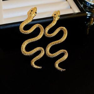 Boucles d'oreilles serpent dorées exagérées, strass et goutte d'huile, style rétro unique, boucles pendantes serpent pour femme Acier inoxydable style affirmé et vente de liquidation