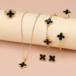 ARHANORY Ensemble de 5 pièces: Collier, Bracelet, Bague et Boucles d'oreilles Trèfle à quatre feuilles - Noir